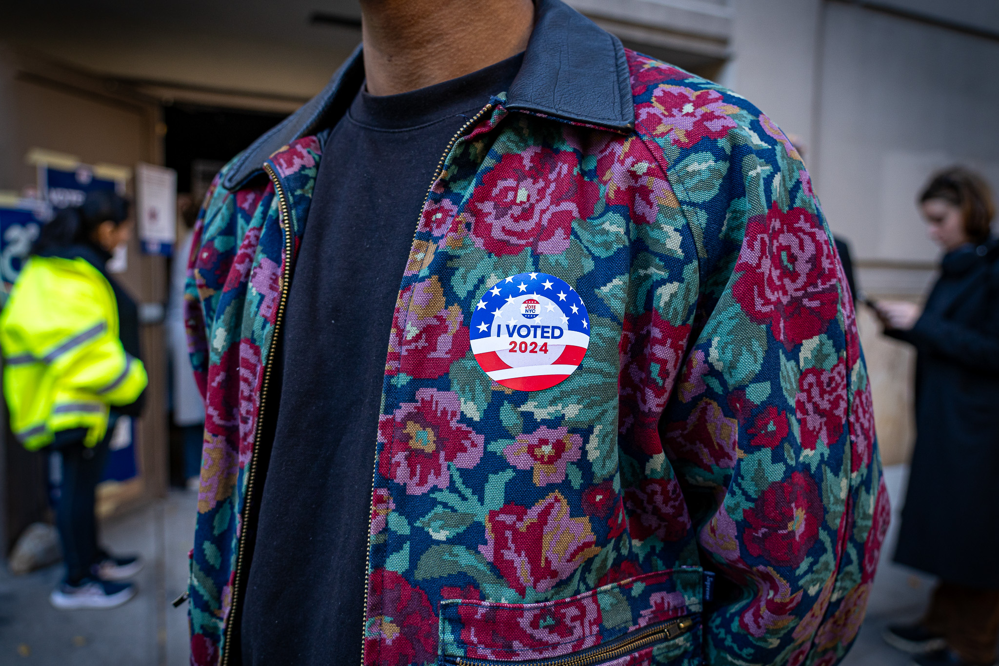 Young voter proudly wears voting stickers in New York City